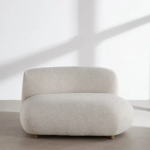 Fauteuil arrondi bouclettes beiges